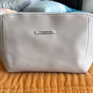 Cream Cosmetic Travel Pouch Filled With Items